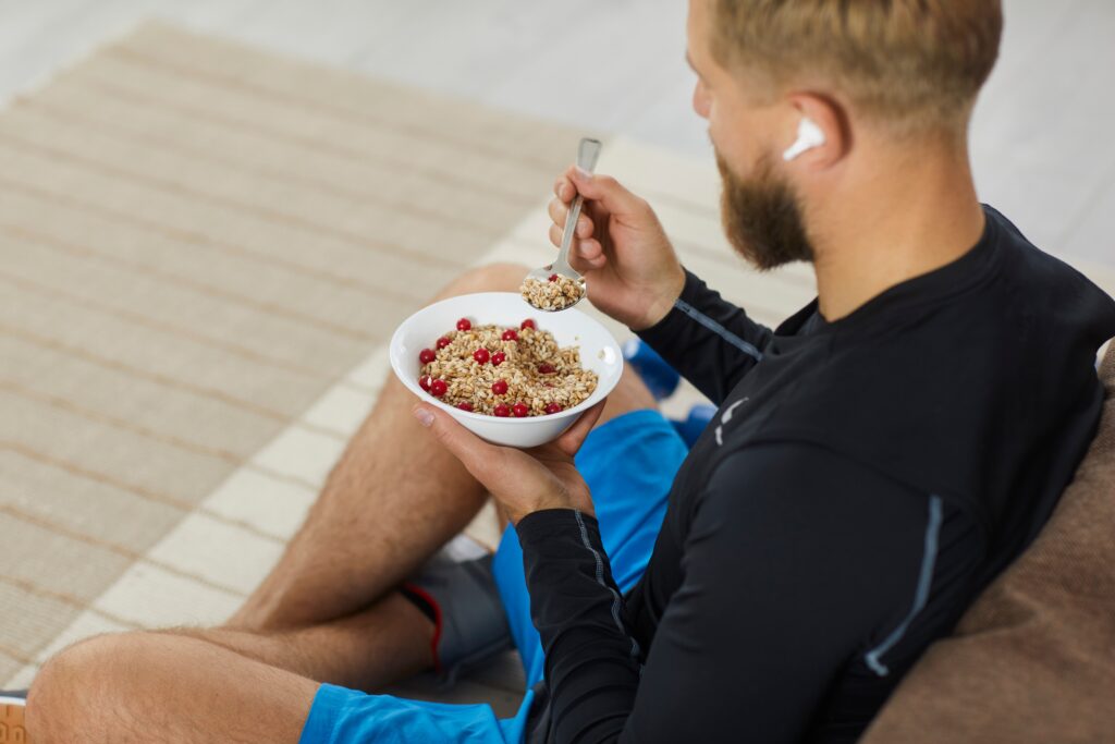 Athlete enjoying a meal to gain weight and build muscle